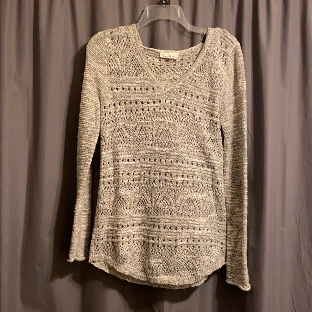 Knit long sleeve sweater with a hood